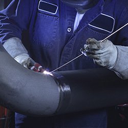 Man Tig Welding A Pipe